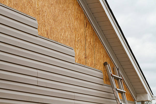 Professional Vinyl Siding technician working in Whitsett, NC
